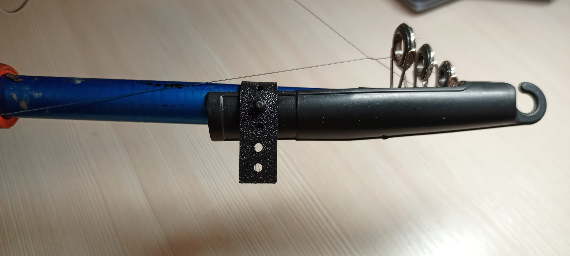 photo 2 strap for fishing rod cap